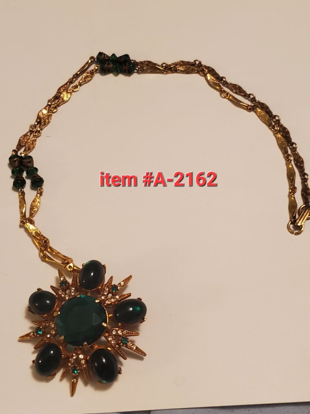 1 Gold green gem stone brooch necklace, item # A 2162, wt.  43 grams.